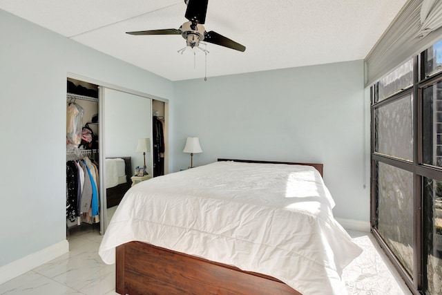 bedroom featuring a textured ceiling, a closet, and ceiling fan