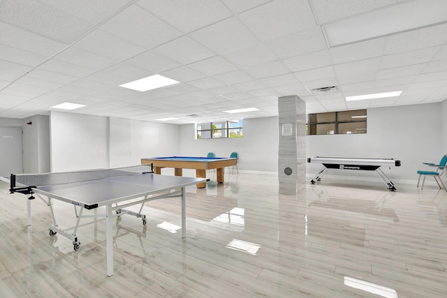 recreation room with a paneled ceiling, light hardwood / wood-style flooring, and pool table