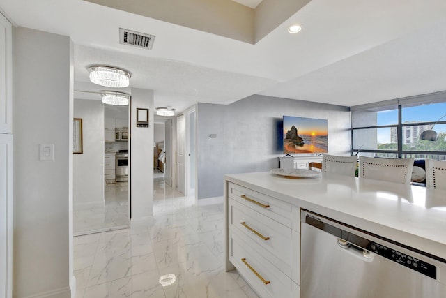 kitchen featuring white cabinetry and stainless steel appliances