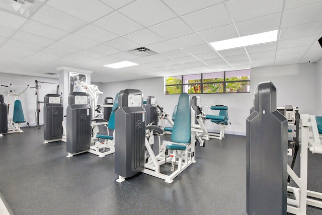 exercise room featuring a paneled ceiling