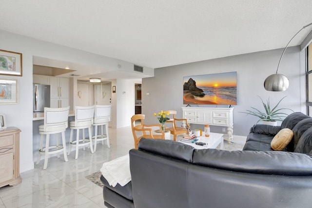 living room with a textured ceiling