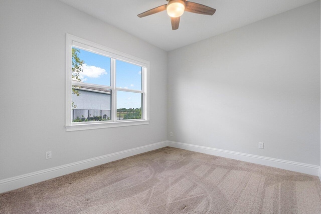 spare room with ceiling fan and carpet floors