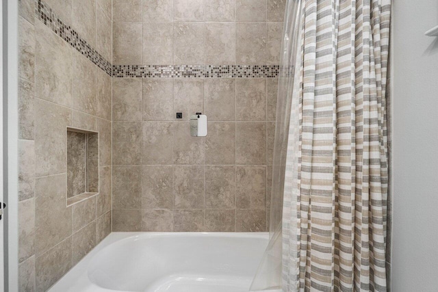 bathroom featuring shower / bath combo with shower curtain