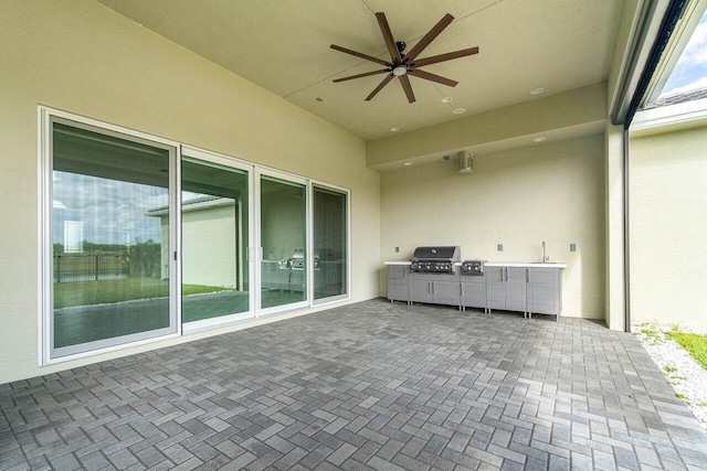 view of patio / terrace with ceiling fan, area for grilling, and sink