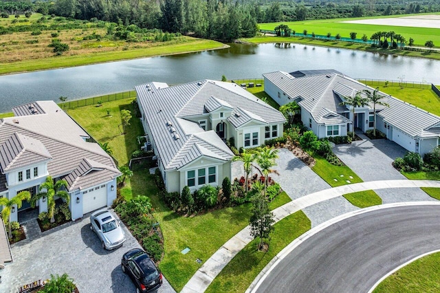 birds eye view of property with a water view