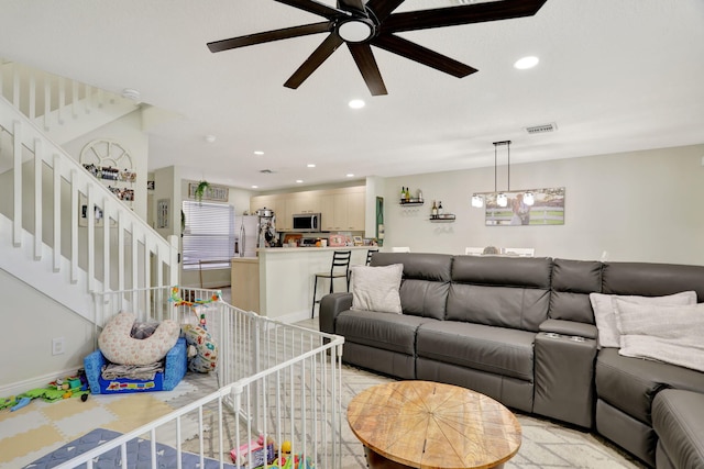 living room featuring ceiling fan