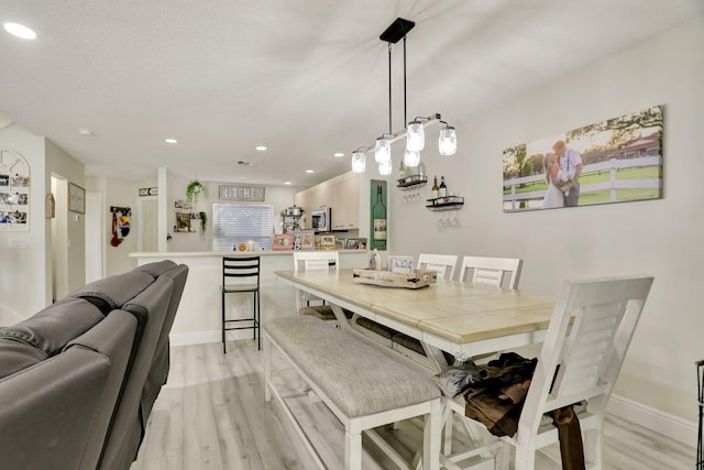 dining room featuring light hardwood / wood-style floors