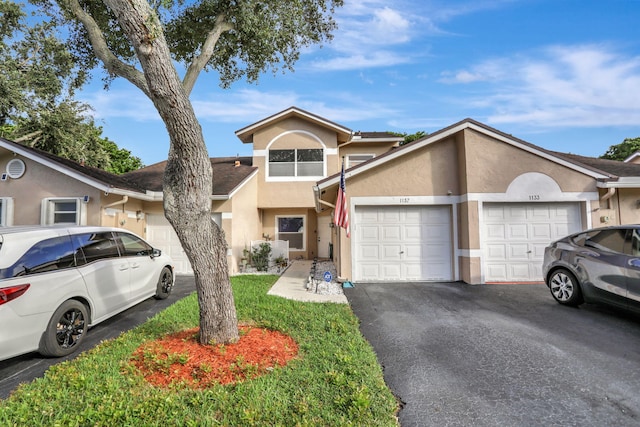 view of front of property featuring a garage