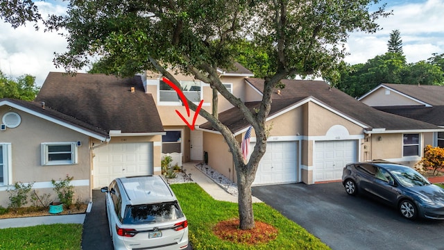 view of front of property with a garage