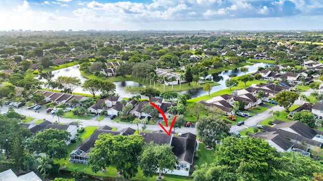 birds eye view of property featuring a water view