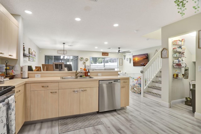 kitchen with pendant lighting, stainless steel appliances, light brown cabinetry, sink, and ceiling fan