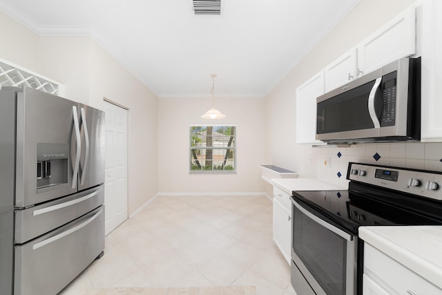 kitchen with pendant lighting, backsplash, white cabinets, ornamental molding, and appliances with stainless steel finishes