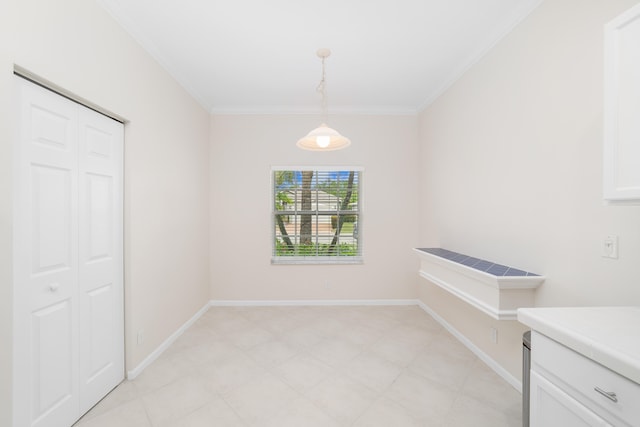 unfurnished dining area with crown molding