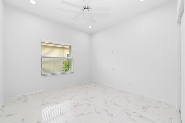 spare room with ceiling fan