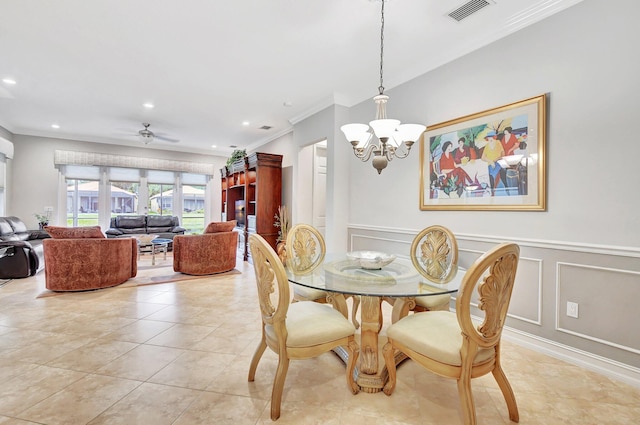 dining space with ceiling fan with notable chandelier, ornamental molding, and light tile patterned flooring