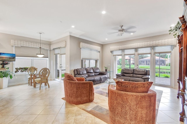 tiled living room with ceiling fan and crown molding