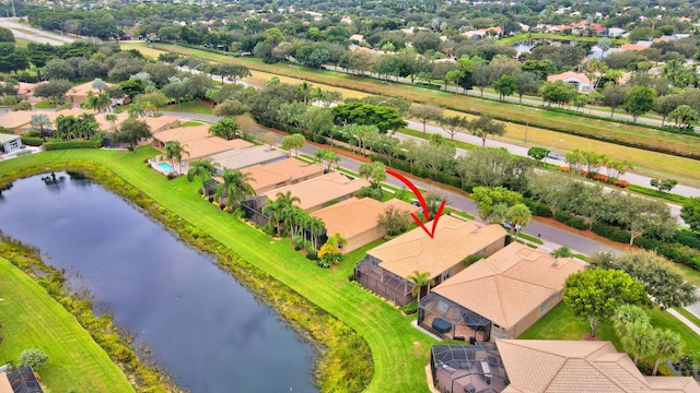 birds eye view of property featuring a water view