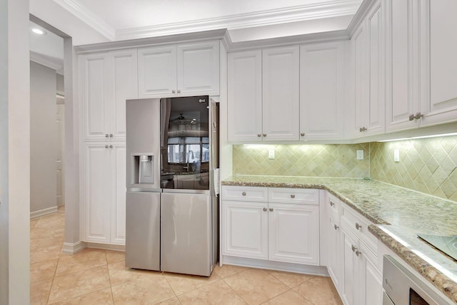 kitchen featuring white cabinetry, light stone counters, stainless steel refrigerator with ice dispenser, crown molding, and decorative backsplash