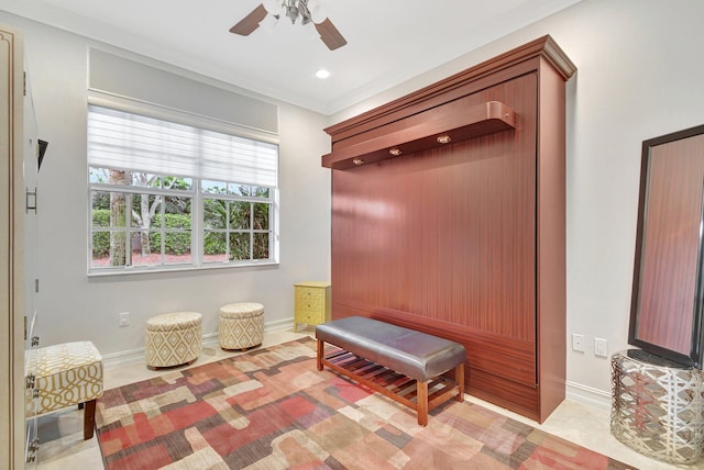 mudroom with ceiling fan and ornamental molding