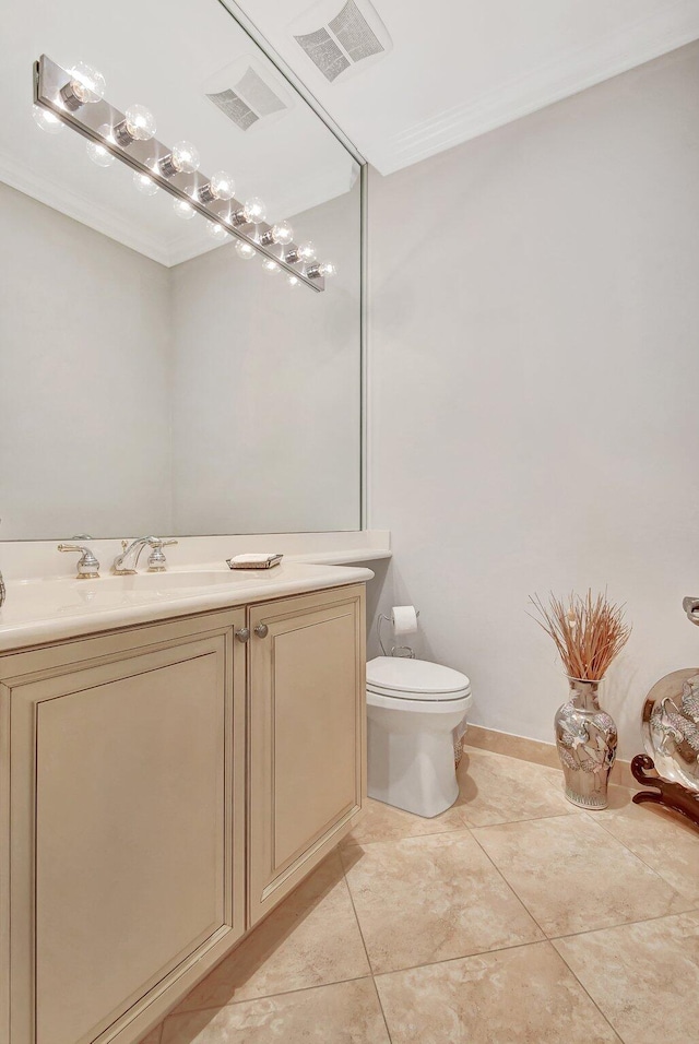 bathroom featuring tile patterned flooring, vanity, and toilet