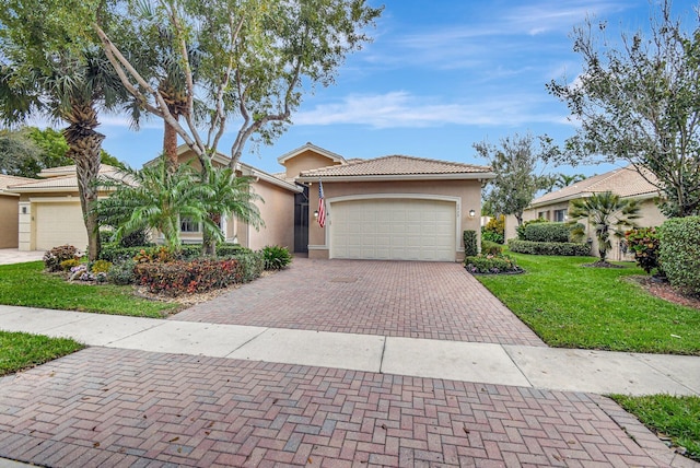 view of front of property featuring a garage and a front lawn