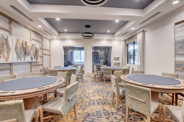 dining space with a tray ceiling