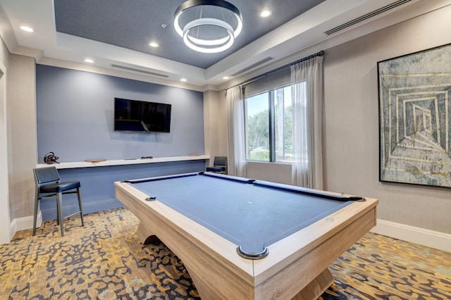 playroom with a tray ceiling and billiards