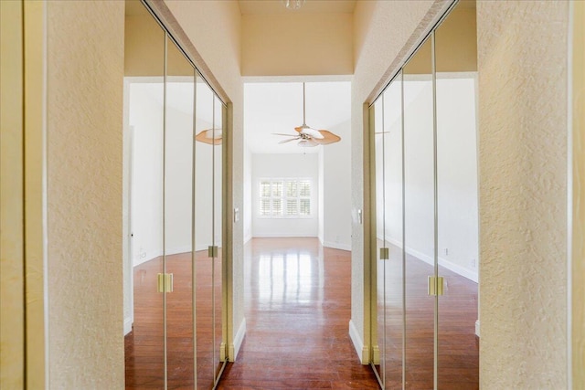 hall with hardwood / wood-style flooring