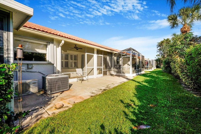 view of yard featuring a patio area, cooling unit, a lanai, and ceiling fan