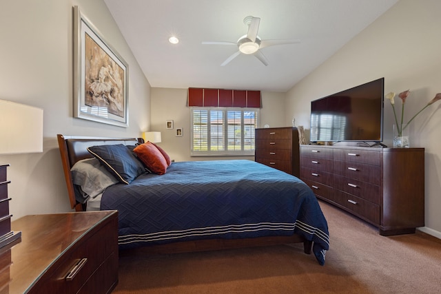 carpeted bedroom featuring ceiling fan and vaulted ceiling