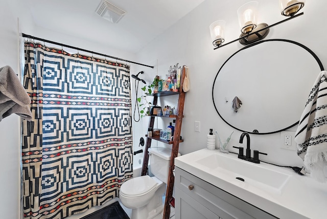 full bathroom with shower / tub combo with curtain, vanity, and toilet