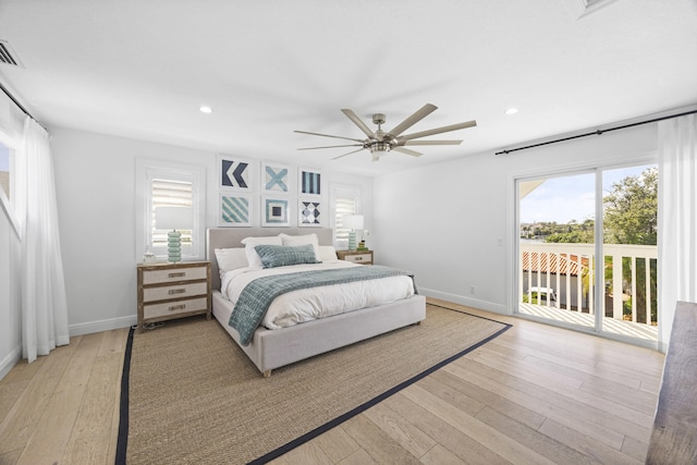 bedroom featuring access to exterior, light wood-type flooring, and ceiling fan