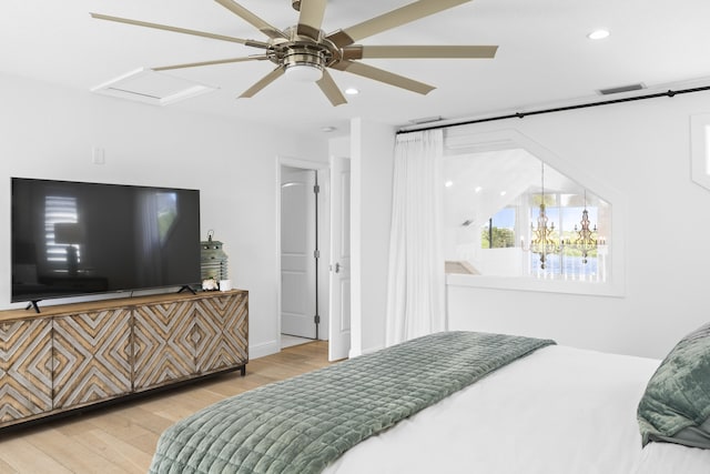 bedroom featuring light wood-type flooring and ceiling fan