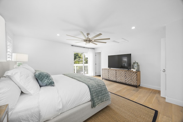 bedroom featuring access to outside, light hardwood / wood-style flooring, and ceiling fan