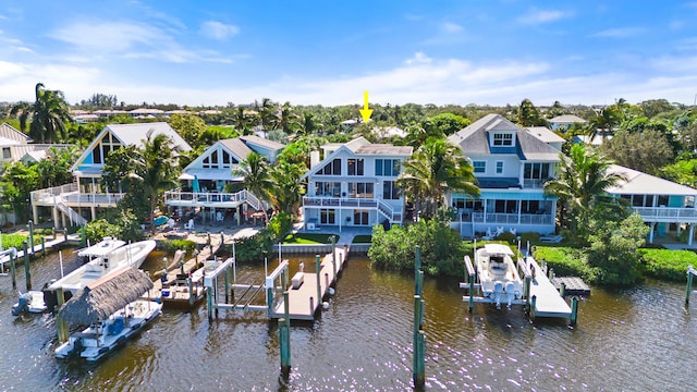 birds eye view of property with a water view