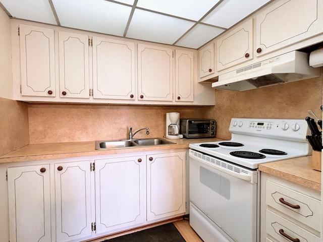 kitchen with light hardwood / wood-style flooring, sink, and electric range