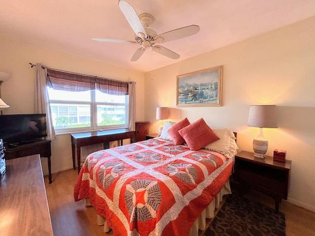 bedroom with hardwood / wood-style flooring and ceiling fan