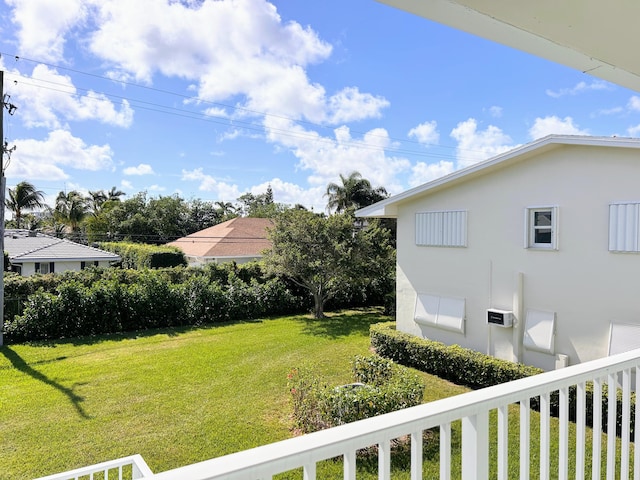 view of yard with a balcony