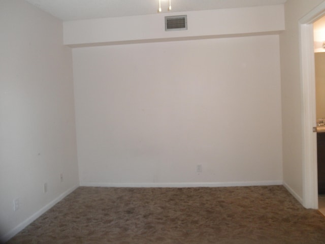 empty room featuring carpet flooring