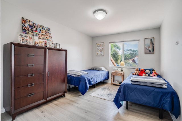 bedroom with light hardwood / wood-style flooring