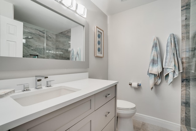 bathroom featuring tile patterned flooring, vanity, toilet, and a shower with door