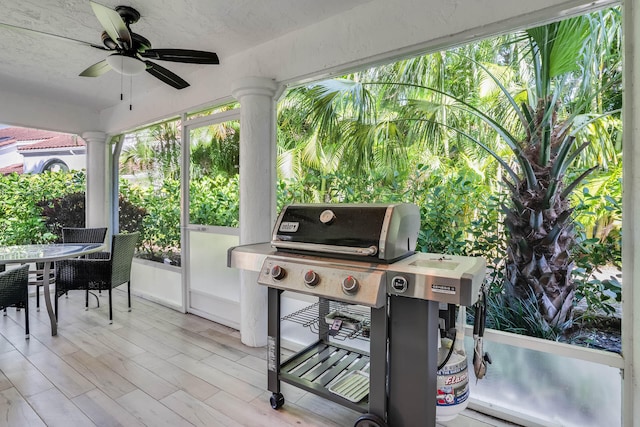 view of patio / terrace with area for grilling and ceiling fan