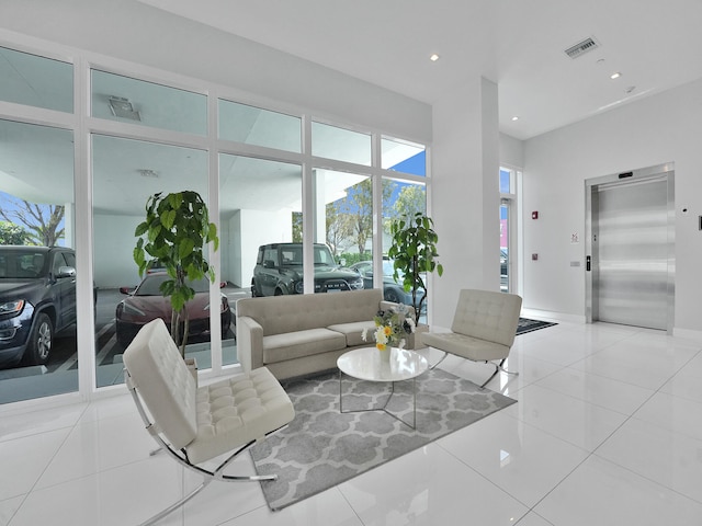 tiled living room featuring elevator