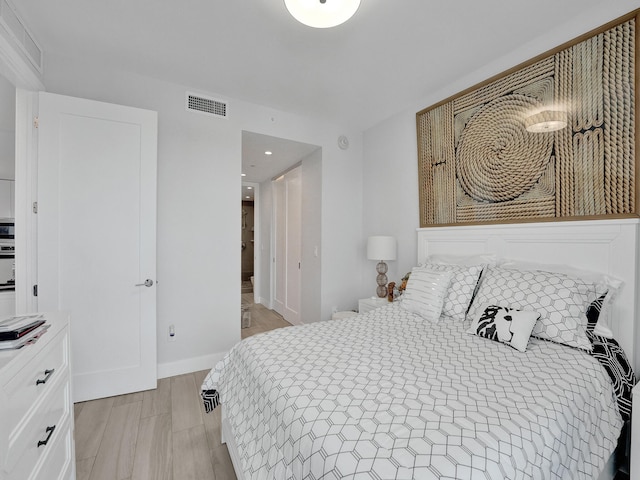 bedroom featuring light hardwood / wood-style floors