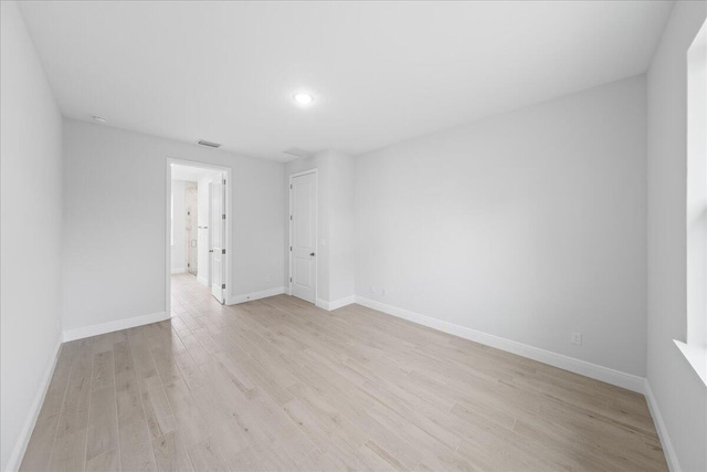 spare room with light hardwood / wood-style floors