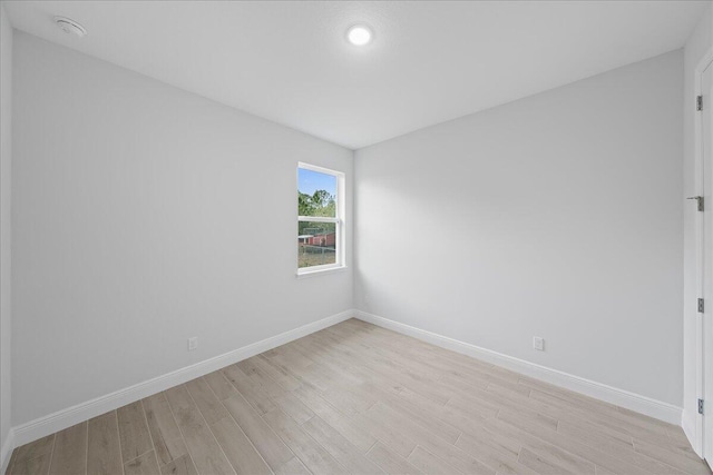 spare room with light wood-type flooring