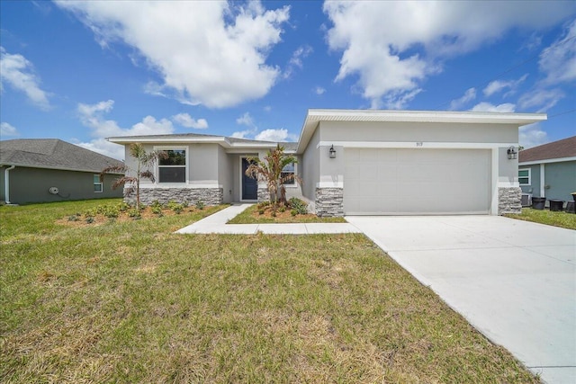 view of front of house featuring a garage and a front lawn