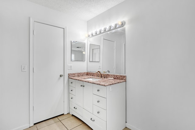 bathroom with vanity, a textured ceiling, tile patterned floors, and ceiling fan