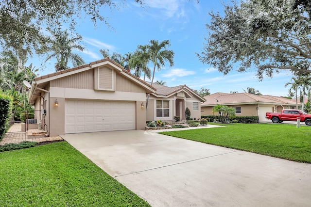 ranch-style home with a front lawn and a garage