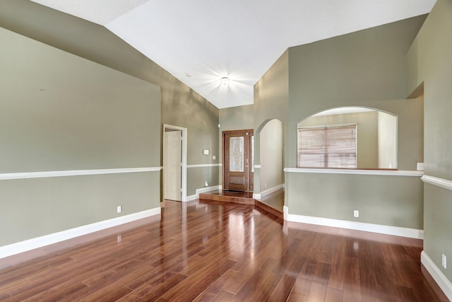 entrance foyer featuring hardwood / wood-style floors and high vaulted ceiling